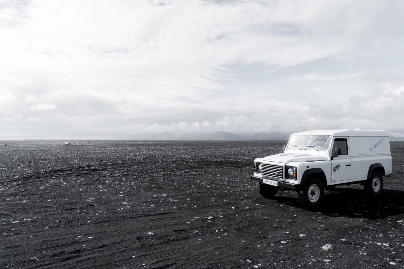 Land Rover from Kuku Campers on black beach in Iceland